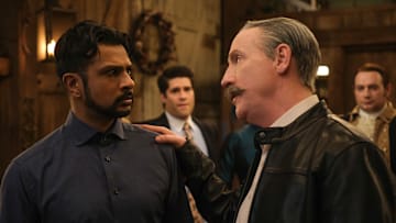 “The Devil Went Down to Woodstone” – Ghosts. Pictured (L-R): Utkarsh Ambudkar as Jay and Matt Walsh as Elias Woodstone. Photo: Bertrand Calmeau/CBS ©2025 CBS Broadcasting, Inc. All Rights Reserved.