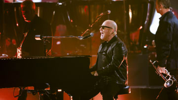 Billy Joel performing at The 66th Annual Grammy Awards.