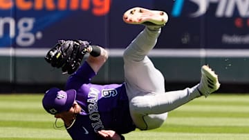 Colorado Rockies centerfielder Brenton Doyle plays a play on a single hit by Arizona Diamondbacks Ketel Marte in the first inning during a spring training game at Salt River Fields in Phoenix on March 19, 2025.