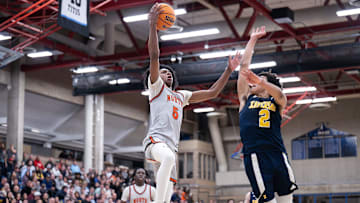 North High's Amir Jenkins soars toward the hoop during Wednesday's win over Xaverian.