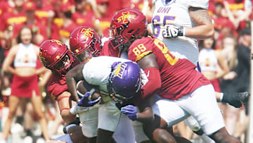 Iowa State Cyclones defensive line Tyler Onyedim (11), defensive end Trent Jones II (89), defensive back Jeremiah Cooper (4), and linebacker Carson Willich (14) take down Northern Iowa Panthers running back Tye Edwards (2) during the first quarter in the season-opening game at Jack Trice Stadium on Saturday, Sept. 2, 2023, in Ames, Iowa.
