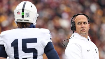 Penn State Nittany Lions head coach James Franklin looks at quarterback Drew Allar (15) 