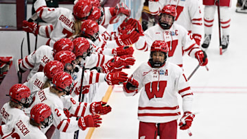 Wisconsin Badgers forward Laila Edwards is congratulated by teammates after scoring a goal against Minnesota in the first period of an NCAA women's Frozen Four semifinal Friday, March 21, 2025, at Ridder Arena in Minneapolis, Minnesota.