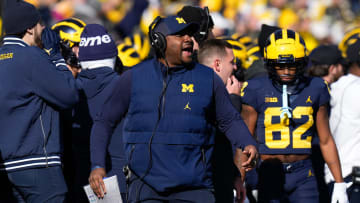 Nov 25, 2023; Ann Arbor, Michigan, USA; Michigan Wolverines wide receivers coach Ron Bellamy yells from the sideline during the NCAA football game against the Ohio State Buckeyes at Michigan Stadium.