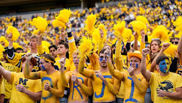 Sep 7, 2024; Ann Arbor, Michigan, USA; Michigan fans cheer for the Wolverines against Texas during the first half at Michigan Stadium. Mandatory Credit: Junfu Han-USA TODAY Network via Imagn Images