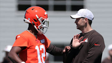 Browns quarterback Shedeur Sanders works with offensive coordinator Tommy Rees during rookie minicamp May 9, 2025, in Berea.