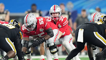 Dec 29, 2023; Arlington, Texas, USA; Ohio State Buckeyes quarterback Devin Brown (33) lines up for a