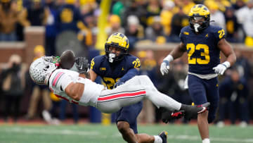 Nov 25, 2023; Ann Arbor, Michigan, USA; Michigan Wolverines defensive back Quinten Johnson (28) hits Ohio State Buckeyes wide receiver Emeka Egbuka (2) forcing an incomplete pass during the second half of the NCAA football game at Michigan Stadium. Ohio State lost 30-24.