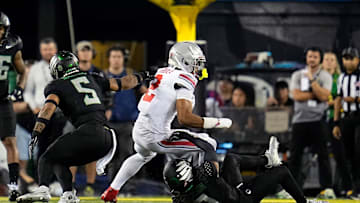 Oct 12, 2024; Eugene, Oregon, USA; Ohio State Buckeyes wide receiver Emeka Egbuka (2) gets tackled by Oregon Ducks defensive back Brandon Johnson (3) after a catch in the second half during the NCAA football game at Autzen Stadium