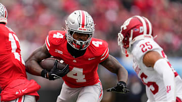 Ohio State Buckeyes wide receiver Jeremiah Smith (4) runs toward Indiana Hoosiers defensive back Amare Ferrell (25) during the second half of the NCAA football game at Ohio Stadium in Columbus on Saturday, Nov. 23, 2024. Ohio State won 38-15.