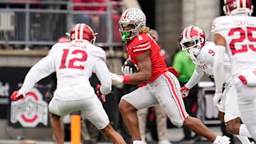 Ohio State Buckeyes running back Quinshon Judkins (1) runs past Indiana Hoosiers defensive back Terry Jones Jr. (12) during the first half of the NCAA football game at Ohio Stadium in Columbus on Saturday, Nov. 23, 2024.