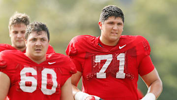 Ohio State Buckeyes offensive lineman Ben Christman (71) runs beside Ryan Smith (60) during football training camp at the Woody Hayes Athletic Center in Columbus on Tuesday, Aug. 10, 2021.

Ohio State Football Training Camp