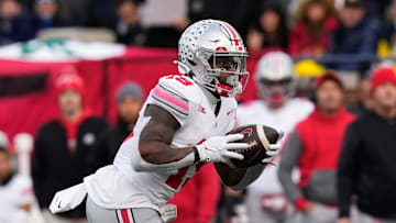 Nov 25, 2023; Ann Arbor, Michigan, USA; Ohio State Buckeyes running back Chip Trayanum (19) carries the ball during the NCAA football game against the Michigan Wolverines at Michigan Stadium. Ohio State lost 30-24.