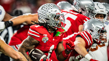 Ohio State Buckeyes running back Quinshon Judkins (1) runs the ball in the second quarter as the Texas Longhorns play the Ohio State Buckeyes in the Cotton Bowl College Football Playoff semi-final at AT&T Stadium in Dallas, Texas, Jan. 10, 2025.