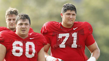 Ohio State Buckeyes offensive lineman Ben Christman (71) runs beside Ryan Smith (60) during football training camp at the Woody Hayes Athletic Center in Columbus on Tuesday, Aug. 10, 2021.
