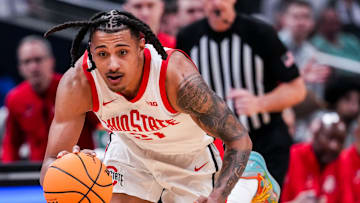 Ohio State Buckeyes forward Devin Royal (21) dribbles down the court Wednesday, March 12, 2025, in a first round game at the 2025 TIAA Big Ten Men’s Basketball Tournament between the Iowa Hawkeyes and the Ohio State Buckeyes at Gainbridge Fieldhouse in Indianapolis.