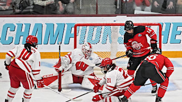 Wisconsin goaltender Ava McNaughton and defender Emma Venusio and Ohio State left wing Joy Dunne (16) and defender MIra Jungaker battle in front of the Wisconsin net during the second period of the NCAA women's hockey Frozen Four chamionship game Sunday, March 23, 2025, at Ridder Arena in Minneapolis, Minnesota.