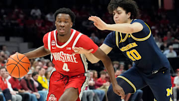 Mar 3, 2024; Columbus, OH, USA; Ohio State Buckeyes guard Dale Bonner (4) dribbles around Michigan Wolverines guard George Washington III (40) during their NCAA Division I Mens basketball game at Value City Arena.