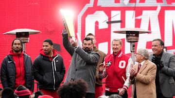Ohio State Buckeyes head coach Ryan Day hoists the championship trophy during the Ohio State Buckeyes College Football Playoff National Championship celebration at Ohio Stadium in Columbus on Jan. 26, 2025.