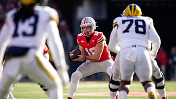 Ohio State Buckeyes quarterback Will Howard (18) takes a snap during the second half of the NCAA football game against the Michigan Wolverines at Ohio Stadium in Columbus on Saturday, Nov. 30, 2024. Michigan won 13-10.