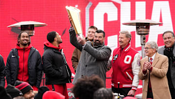 Ohio State Buckeyes head coach Ryan Day hoists the College Football Playoff trophy during the Ohio State Buckeyes National Championship celebration at Ohio Stadium in Columbus on Jan. 26, 2025.