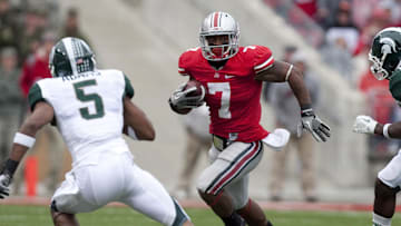 October 1, 2011; Columbus, OH, USA; Ohio State Buckeyes running back Jordan Hall (7) tries to get past Michigan State Spartans cornerback Johnny Adams (5) at Ohio Stadium. Michigan State won the game 10-7. Mandatory Credit: Greg Bartram-Imagn Images