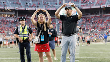 Ohio State Buckeyes head coach Ryan Day and his wife Nina Day sing \"Carmen Ohio\" following the NCAA football game against the Tulsa Golden Hurricane at Ohio Stadium in Columbus on Saturday, Sept. 18, 2021. Ohio State won 41-20.

Tulsa At Ohio State Football