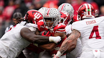 Ohio State Buckeyes running back TreVeyon Henderson (32) runs during the second half of the NCAA football game against the Indiana Hoosiers at Ohio Stadium in Columbus on Saturday, Nov. 23, 2024. Ohio State won 38-15.
