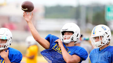 Aug 4, 2022; Findlay, OH, USA; Findlay quarterback Ryan Montgomery looks to throw the ball during practice at Findlay High School on August 4, 2022. Ryan's brother Luke is an offensive linemen committed to Ohio State.

Ceb Osufb Montgomery Kwr 08