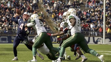 Oct 17, 2015; East Hartford, CT, USA; Connecticut Huskies quarterback Bryant Shirreffs (4) passes the ball under pressure from the South Florida Bulls defense in the second half at Rentschler Field. USF defeated UConn 28-20. Mandatory Credit: David Butler II-USA TODAY Sports