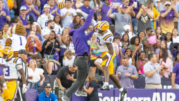 LSU WR Malik Nabors 8 celebrates with Receivers Coach Cortez Hankton after a touchdown as the LSU Tigers take on the Auburn Tigers at Tiger Stadium in Baton Rouge, Louisiana, Saturday, Oct. 14, 2023.