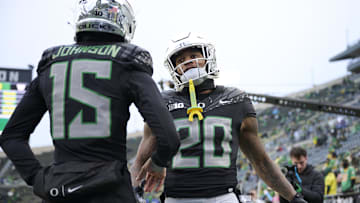 Nov 30, 2024; Eugene, Oregon, US; Oregon Ducks running back Jordan James (20) greets wide receiver Tez Johnson (15) during warm-ups before a game against the Washington Huskies at Autzen Stadium.