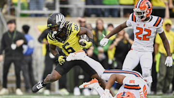 Noah Whittington trucks an Illinois defensive back for a touchdown. The physicality in the Oregon running back room provides a sound foundation for the Oregon offense.