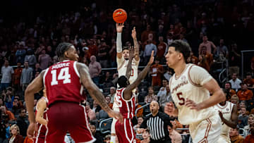 Texas Longhorns guard Jordan Pope (0) shoots for three in the second half of the Longhorns' game against the Oklahoma Sooners at the Moody Center in Austin, March 8, 2025.