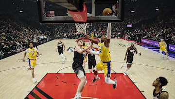 Feb 20, 2025; Portland, Oregon, USA; Los Angeles Lakers forward Rui Hachimura (28) scores a basket during the first half against Portland Trail Blazers center Donovan Clingan (23) at Moda Center. Mandatory Credit: Troy Wayrynen-Imagn Images