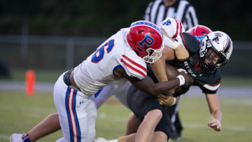 Tylon Lee (6) and Jackson Ward (42) sack quarterback John Nicholas (9) during the Pace vs West Florida football game at West Florida High School in Pensacola on Friday, Sept. 8, 2023.