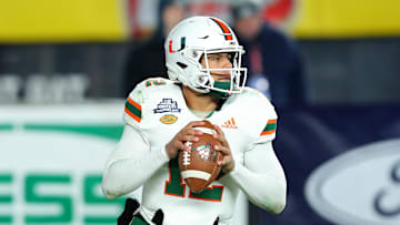 Dec 27, 2018; Bronx, NY, USA; Miami Hurricanes quarterback Malik Rosier (12) drops back to pass against the Wisconsin Badgers during the second quarter in the 2018 Pinstripe Bowl at Yankee Stadium. Mandatory Credit: Rich Barnes-Imagn Images
