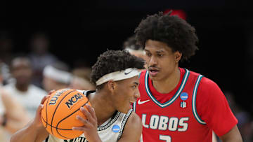 Michigan State Spartans guard Jeremy Fears Jr. (1) keeps the ball away from New Mexico Lobos guard Tru Washington (3) during the second half of an NCAA Tournament Second Round game at Rocket Arena on Sunday, March 23, 2025, in Cleveland, Ohio.