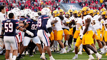 Arizona Wildcats and Arizona State Sun Devils are separated after tempers flare in the second half during the Territorial Cup game at Arizona Stadium in Tucson on Nov. 25, 2022.