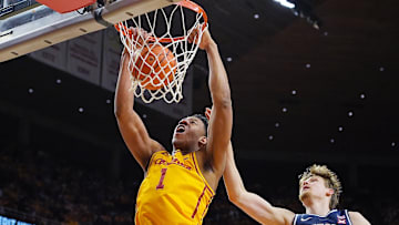 Iowa State Cyclones center Dishon Jackson (1) dunks the ball around Arizona Wildcats forward Henri Veesaar (13) during the first half in the Big-12 men’s basketball showdown at Hilton Coliseum on Saturday March 1, 2025 in Ames, Iowa.