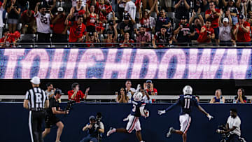 Aug 30, 2025; Tucson, Arizona, USA; Arizona Wildcats running back Kedrick Reescano (3) points up to the sky after he runs a touchdown against the Hawaii Rainbow Warriors during the first quarter of the game at Arizona Stadium. Mandatory Credit: Aryanna Frank-Imagn Images