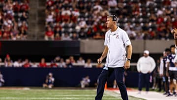 Aug 30, 2025; Tucson, Arizona, USA; Arizona Wildcats head coach Brent Brennan watches the game from the sidelines during the first quarter against the Hawaii Rainbow Warriors at Arizona Stadium. Mandatory Credit: Aryanna Frank-Imagn Images