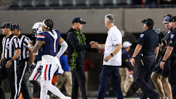 Aug 30, 2025; Tucson, Arizona, USA; Hawaii Rainbow Warriors head coach Timmy Chang shakes hands with Arizona Wildcats head coach Brent Brennan at the end of the game at Arizona Stadium. Mandatory Credit: Aryanna Frank-Imagn Images