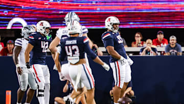 Sep 12, 2025; Tucson, Arizona, USA; Arizona Wildcats defensive lineman Leroy Palu (95) celebrates a tackle against the Kansas State Wildcats during the third quarter of the game at Arizona Stadium. Mandatory Credit: Aryanna Frank-Imagn Images