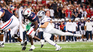 Sep 12, 2025; Tucson, Arizona, USA; Kansas State Wildcats linebacker Gabe Powers (35) tackles Arizona Wildcats running back Ismail Mahdi (21) during the second quarter of the game at Arizona Stadium. Mandatory Credit: Aryanna Frank-Imagn Images