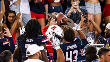 Sep 12, 2025; Tucson, Arizona, USA; Arizona Wildcats defensive back Dalton Johnson (43) holds up the turnover sword during the second quarter of the game against the Kansas State Wildcats at Arizona Stadium. Mandatory Credit: Aryanna Frank-Imagn Images