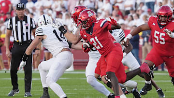 Arizona Wildcats running back Ismail Mahdi (21)runs with the ball against Iowa State during the first quarter in the Big-12 conference showdown on Sept. 27, 2025, at Jack Trice Stadium in Ames, Iowa.