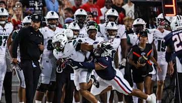 Aug 30, 2025; Tucson, Arizona, USA; Arizona Wildcats defensive lineman Tre Smith (3) tackles Hawaii Rainbow Warriors running back Cam Barfield (0) during the first quarter of the game at Arizona Stadium. Mandatory Credit: Aryanna Frank-Imagn Images