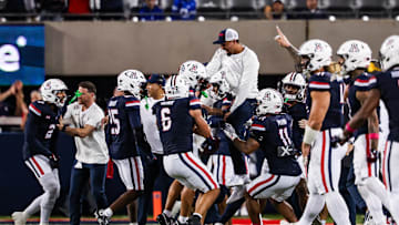Oct 11, 2025; Tucson, Arizona, USA; Arizona Wildcats defensive back Dalton Johnson (43) celebrates an interception he caught from the Brigham Young Cougars with his team during the third quarter of the game at Arizona Stadium. Mandatory Credit: Aryanna Frank-Imagn Images