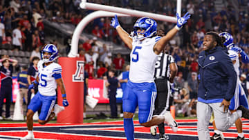 Oct 11, 2025; Tucson, Arizona, USA; Brigham Young Cougars wide receiver Cody Hagen (5) runs onto the field after the Brigham Young Cougars secure the win against the Arizona Wildcats after overtime at Arizona Stadium.  Mandatory Credit: Aryanna Frank-Imagn Images